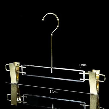 Akrylové vešiaky na nohavice